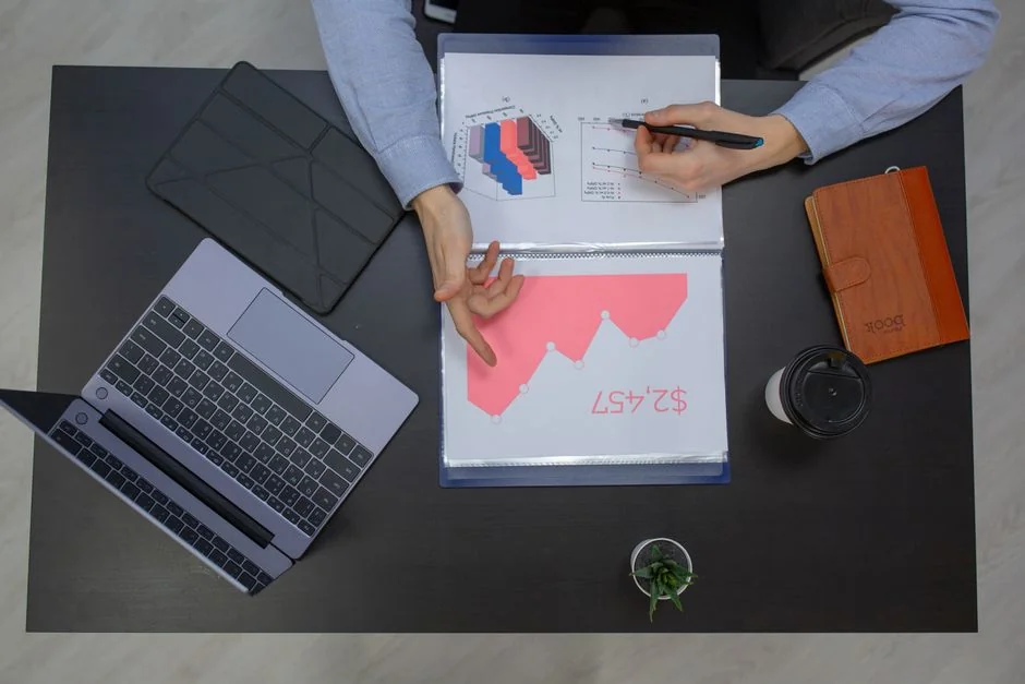 Bright highlighters on a User-Generated Content note against a wooden desk.